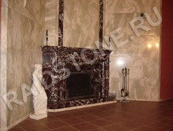 Угловой камин из мрамора Россо Леванте